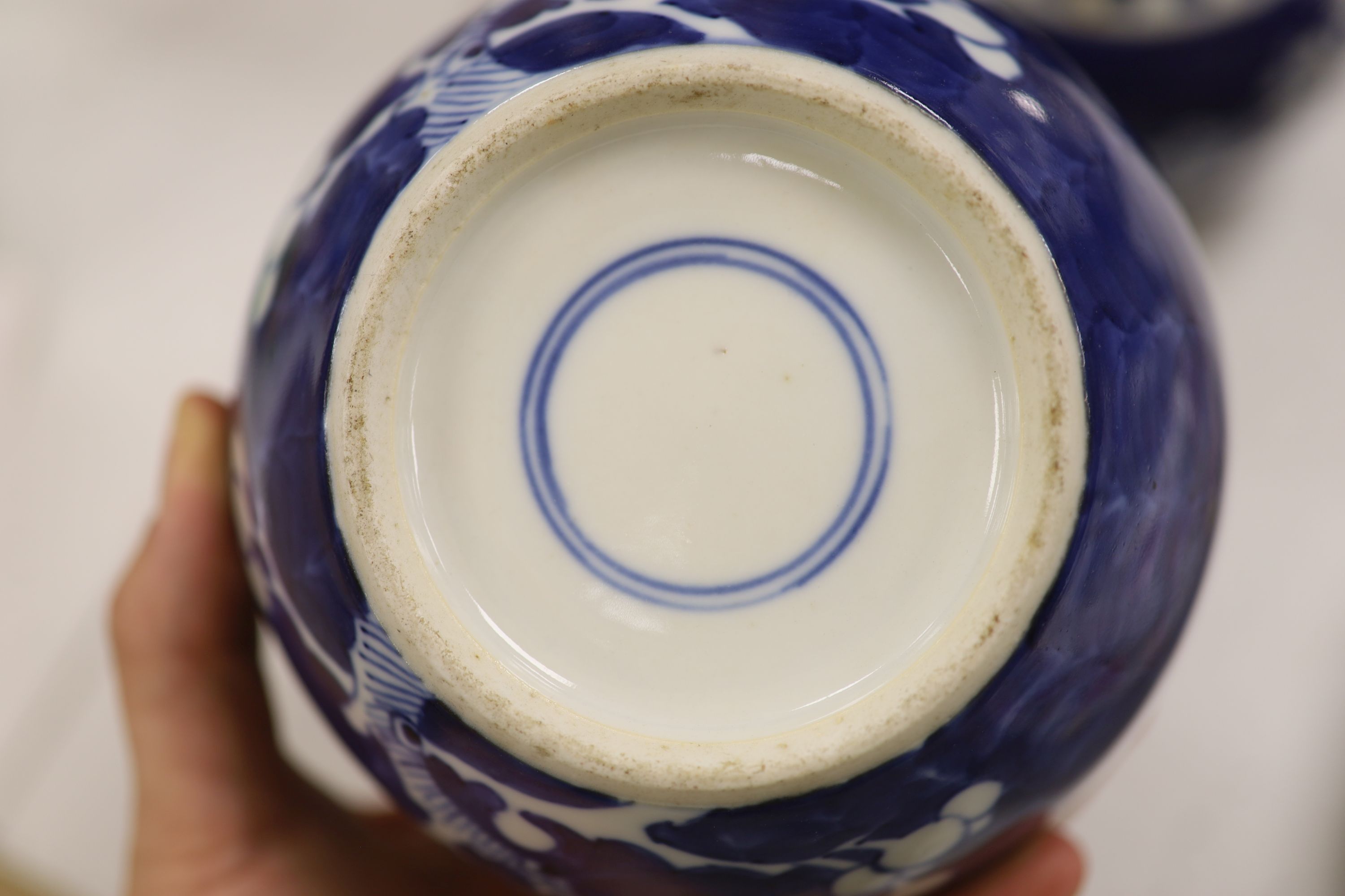 An early 20th century Chinese blue and white ‘prunus’ vase a Republic period millefleur dish, a similar Canton vase and two blue and white jars